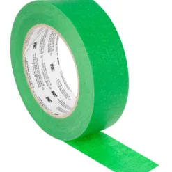 Green painter's tape roll on white background.