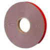 Red double-sided adhesive tape roll