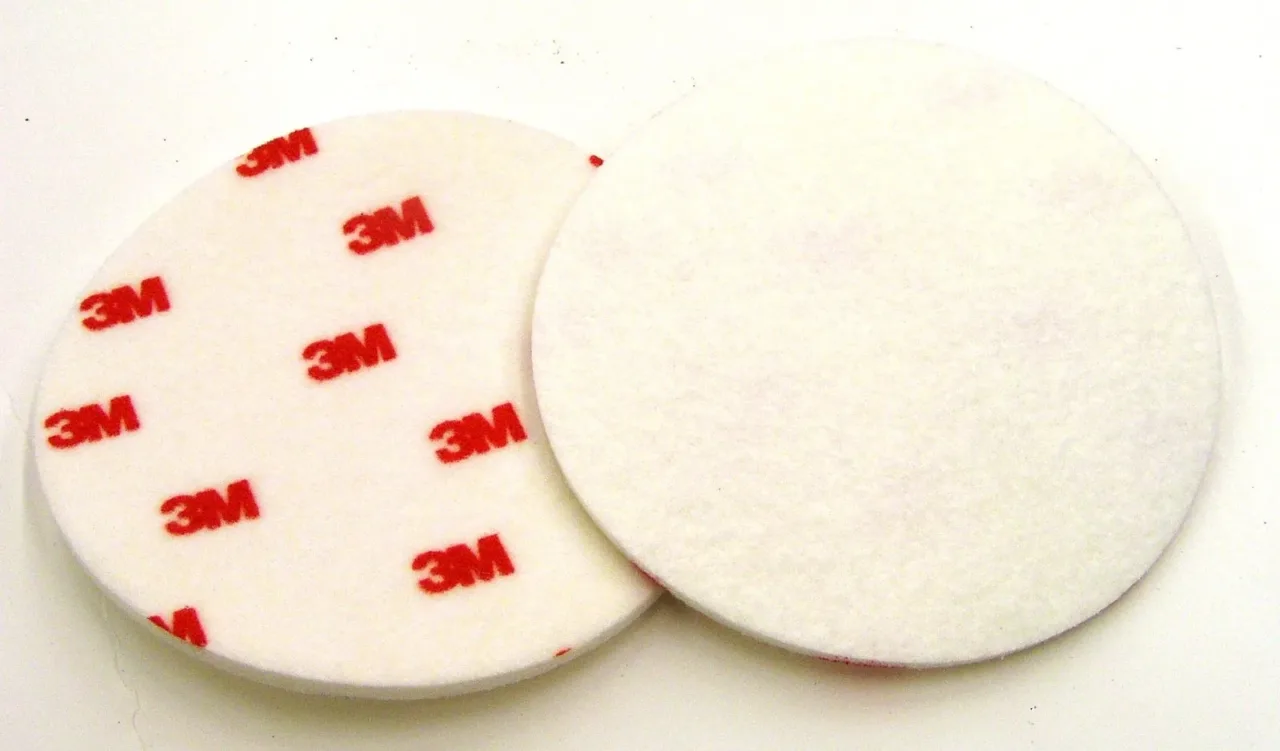 Two 3M buffing pads on white background