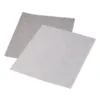 Two textured sandpaper sheets overlapping