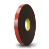 Black adhesive tape with red edge on roll