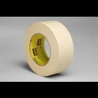 Roll of masking tape on gray background.