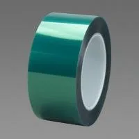 Green roll of adhesive tape on gray background.