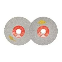Two abrasive grinding wheels with labels