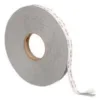 Large roll of adhesive tape with white backing.