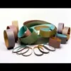 Assorted sanding belts in various sizes and colors.