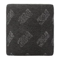 Coarse black scrubbing pad with silver patterns.