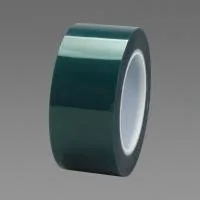 Green adhesive tape roll on gray background