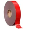 Large roll of red adhesive tape