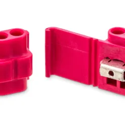 Red electrical wire connectors isolated on white.