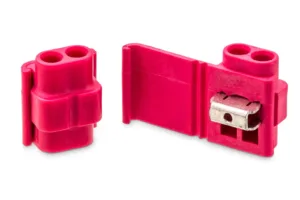 Red electrical wire connectors isolated on white.
