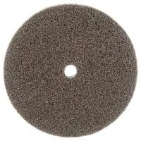 Circular abrasive pad with central hole.