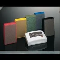 Colorful abrasive blocks on reflective surface.