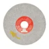 Grinding wheel with red label and arrow marking.