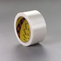 Roll of white adhesive tape on gray background.