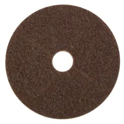Brown abrasive scrubbing pad with central hole.