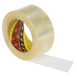 Clear adhesive tape roll on white background